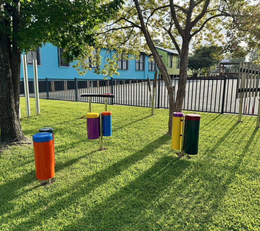 Percussion Play Outdoor Musical Instruments Installed By Scully Outdoor Designs Australia In A School Playground On The Grass Under Some Trees
